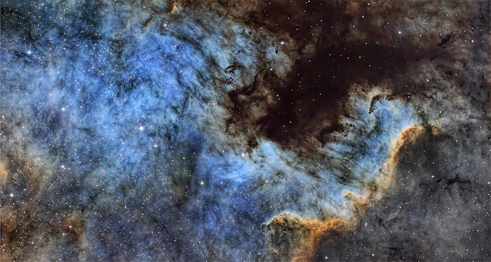 Blue and brown nebulae with stars