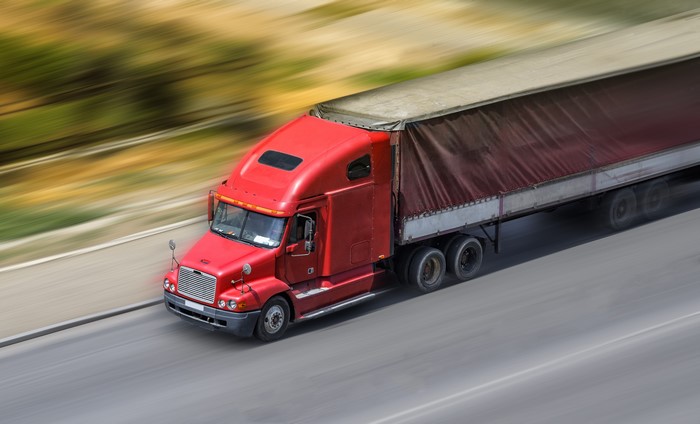 Red Semi-Truck in Motion