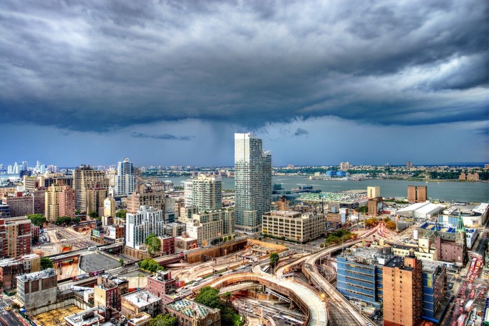 New York City skyline with stormy clouds over Hudson River