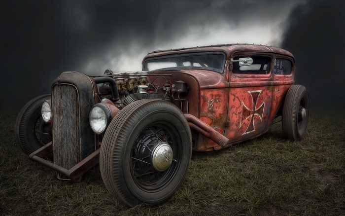 Red rusty hot rod with Iron Cross emblem
