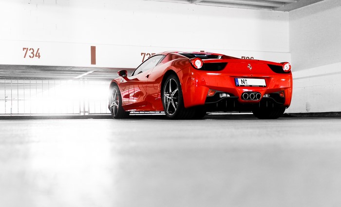 Red Ferrari 458 Italia in parking garage