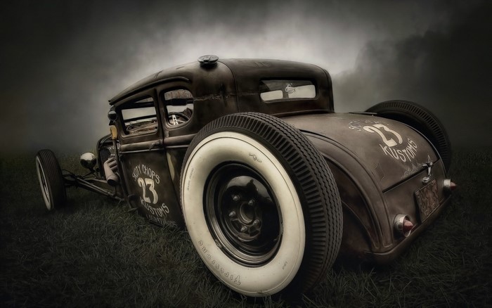 Rusty hot rod with white wall tires