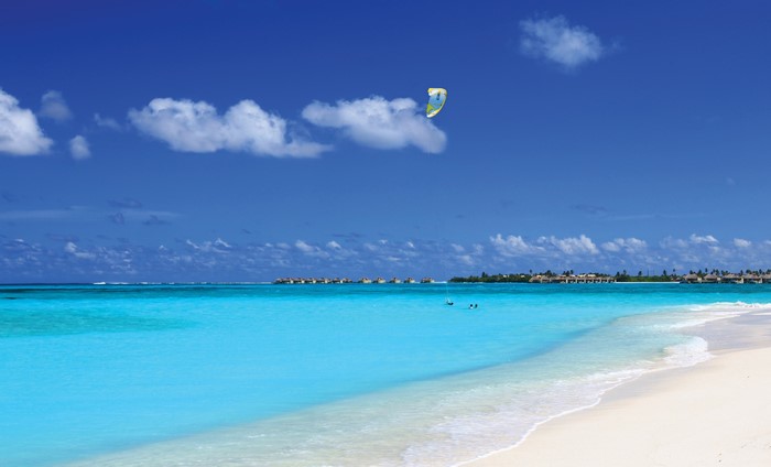 4K Beach with Turquoise Water and Overwater Bungalows