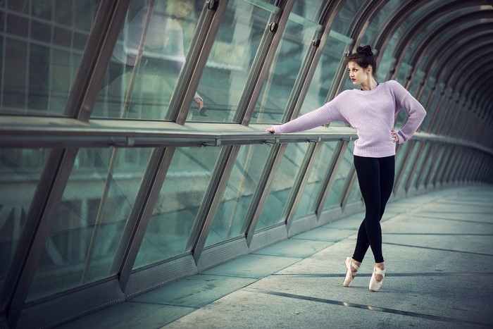 Ballerina in a lilac sweater and black leggings