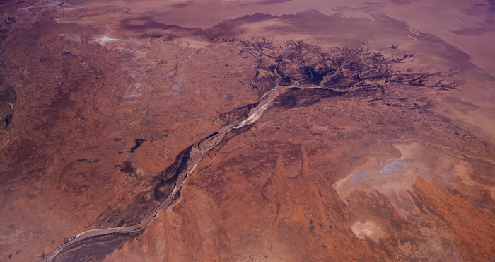 Aerial view of a dry riverbed in a desert landscape