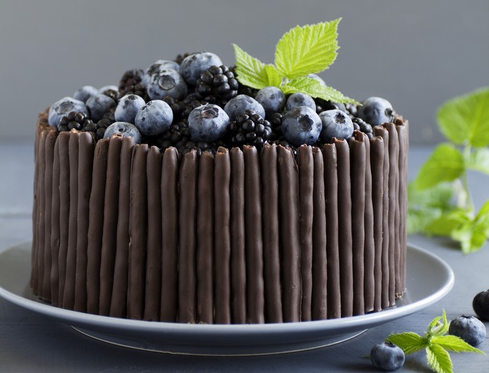 Chocolate cake decorated with blueberries and blackberries