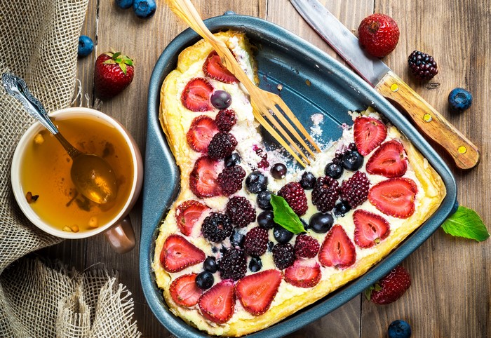 Heart-shaped berry pastry with tea