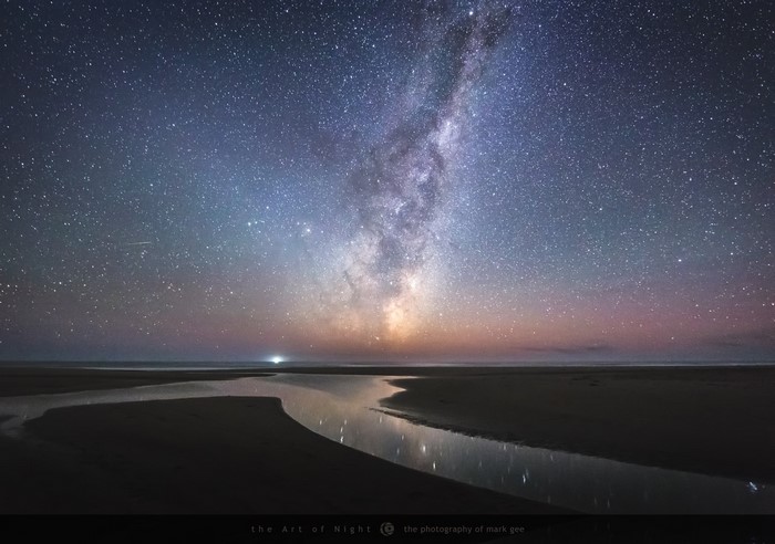 Milky Way over a coastal stream at night