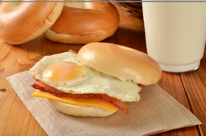 Bagel sandwich with fried egg, bacon, and cheese