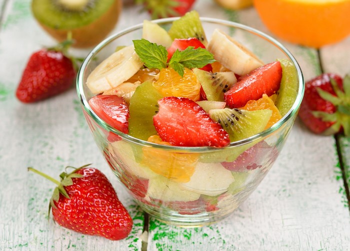 Fruit salad with strawberries, kiwi, banana, and orange