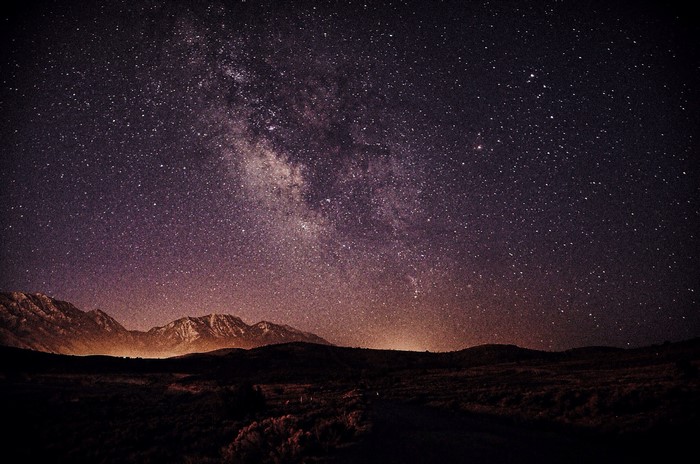 Milky Way galaxy over mountains at night