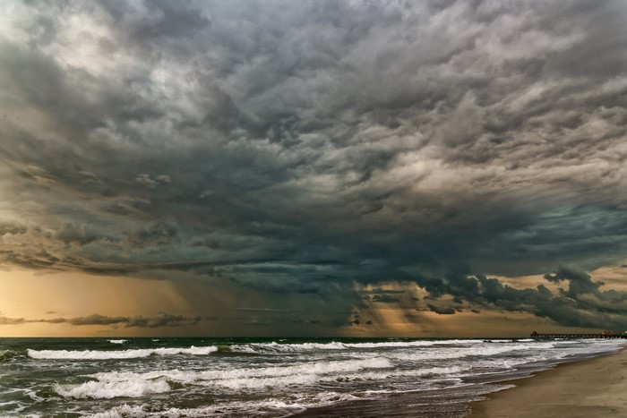 Stormy clouds over the ocean and beach
