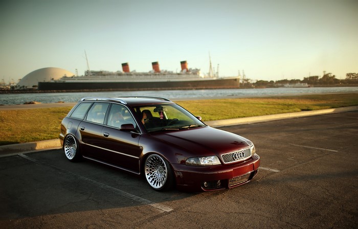 Maroon Audi RS4 Avant Wagon parked by the water