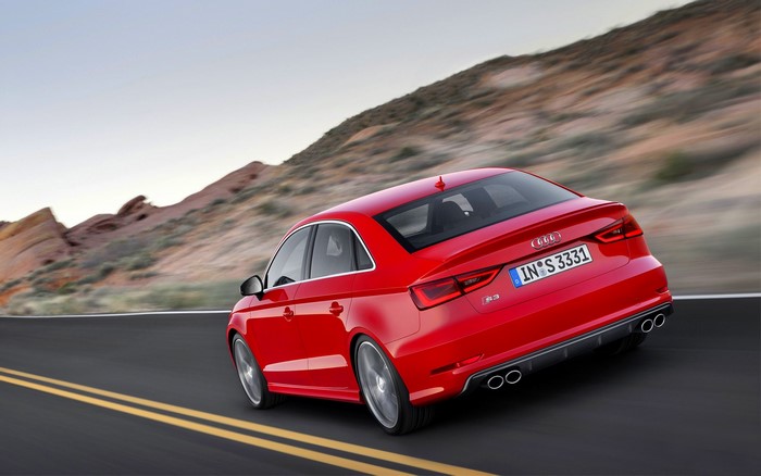 Red Audi S3 Sedan Driving on a Road