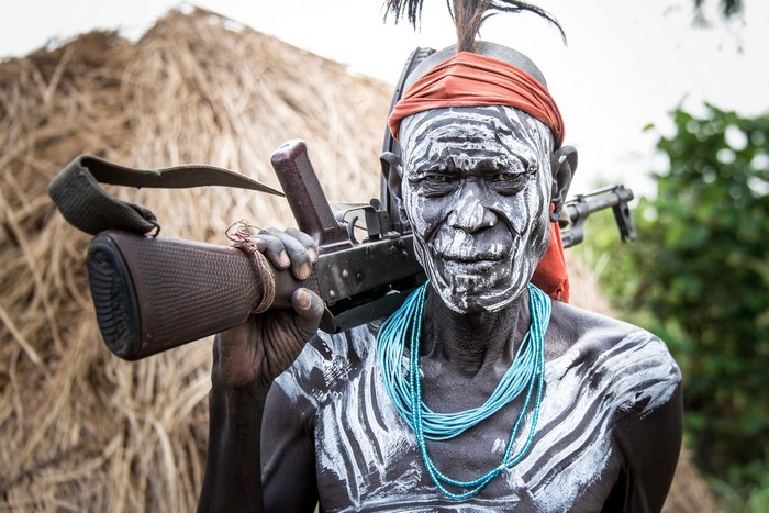 Mursi warrior with assault rifle in Ethiopia