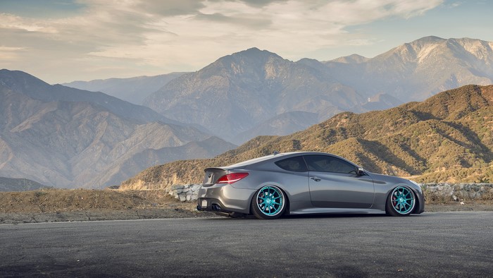 Grey Hyundai Genesis Coupe with Teal Wheels