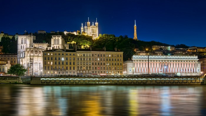 Lyon cityscape with Basilica of Notre-Dame de Fourviere and Rhone River at night
