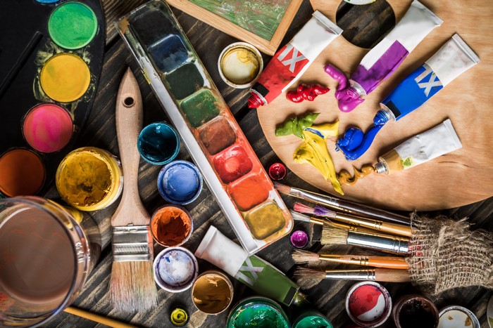 Art supplies: paints, brushes, and palette