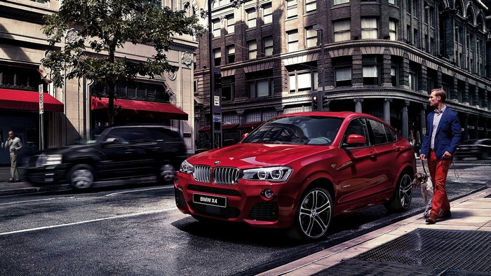 Red BMW X4 F26 on a City Street