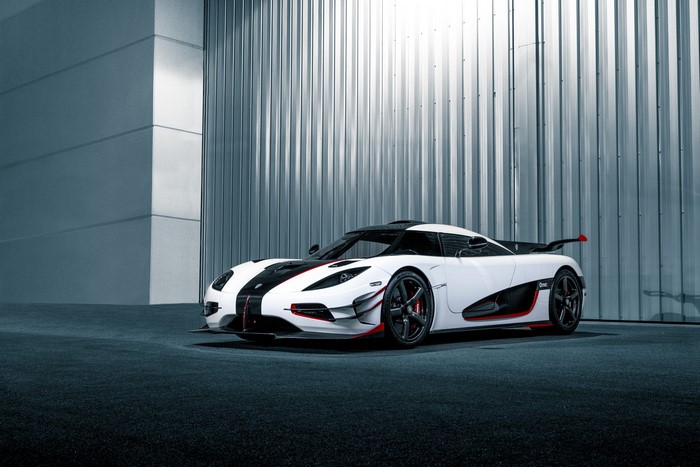 White Koenigsegg car with black and red accents