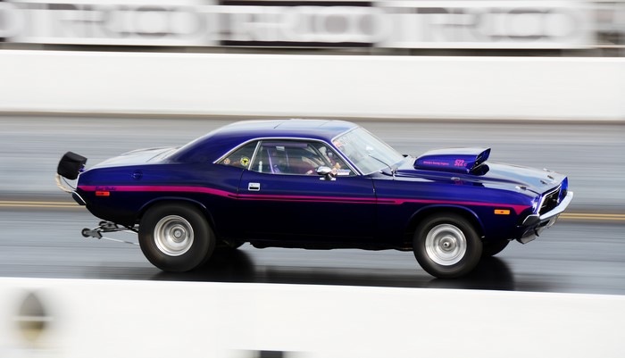 Blue Dodge Challenger Drag Racing Car in Motion
