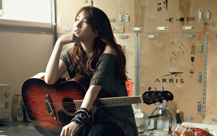 Kara from K-pop with guitar