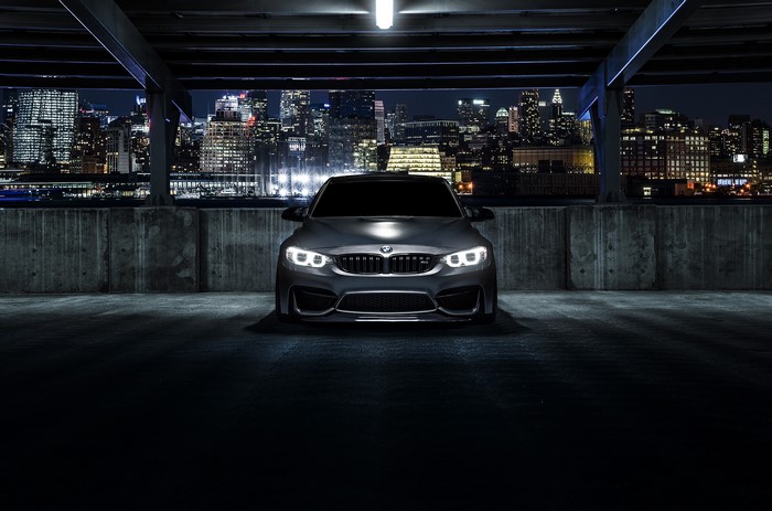 BMW M3 F80 Mode Carbon parked at night