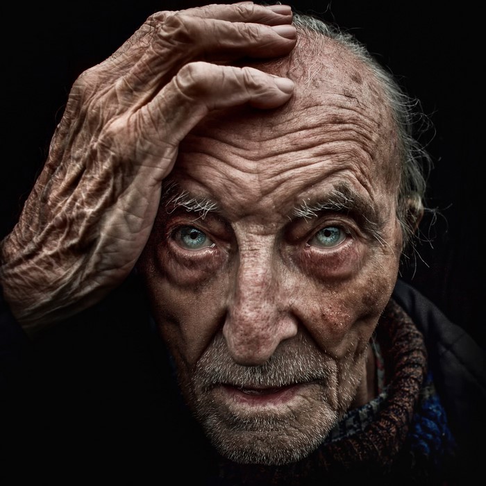 Close-up portrait of an elderly man with blue eyes