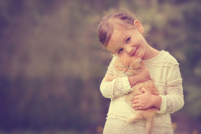 Girl holding a kitten