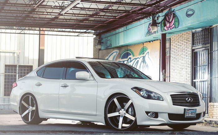 White Infiniti M37S with custom rims
