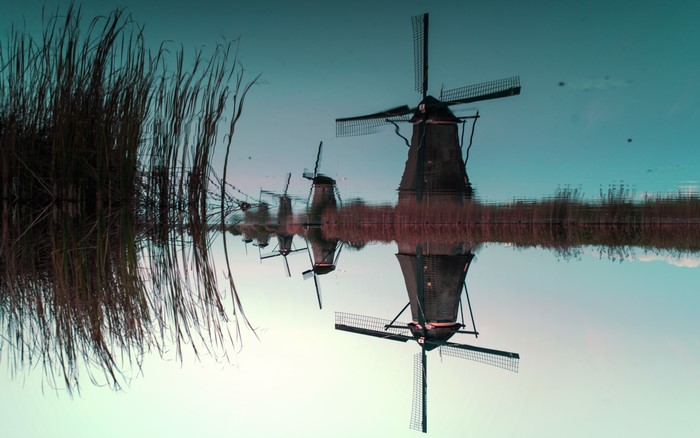 Reflection of windmills in a lake