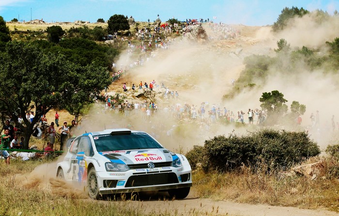 Volkswagen Polo WRC rally car racing on a dusty track