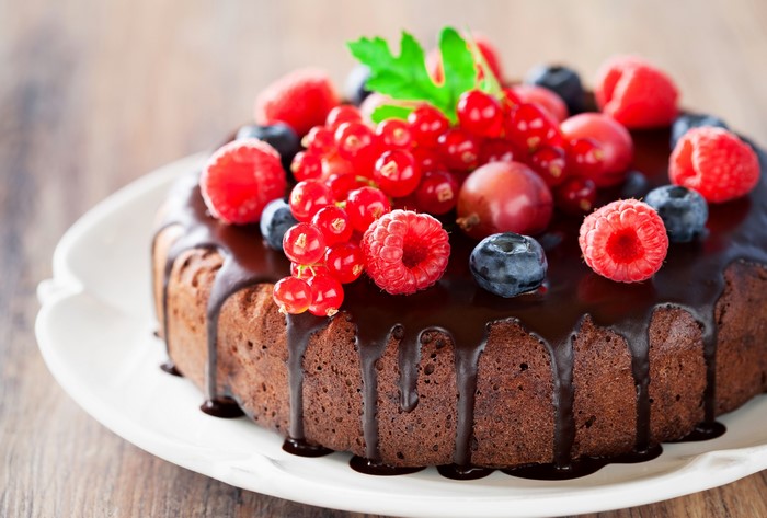 Chocolate cake with berries and chocolate glaze