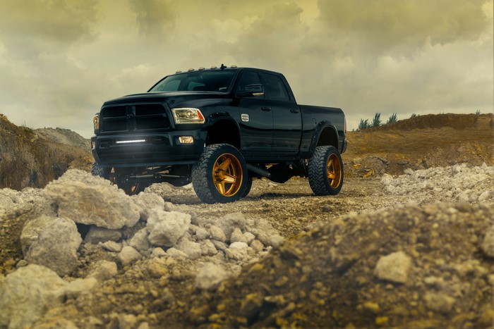 Black Dodge Ram ADV.1 Wheels Truck on Rocky Terrain