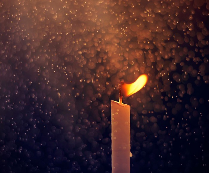 Candle flame with bokeh background