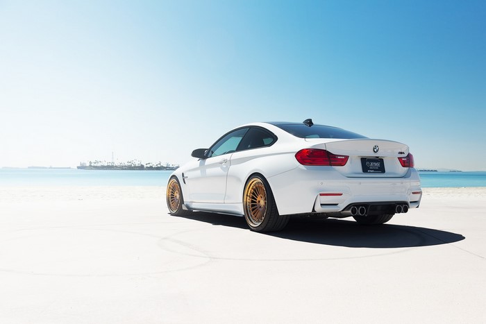 White BMW M4 Coupe on a Beach