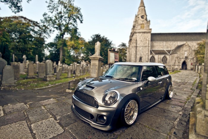 Grey Mini Cooper in a Cemetery with a Church