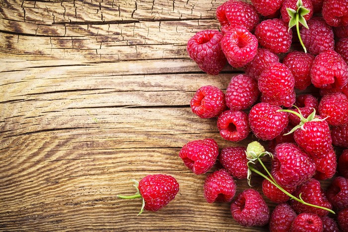 Raspberries on a wooden background