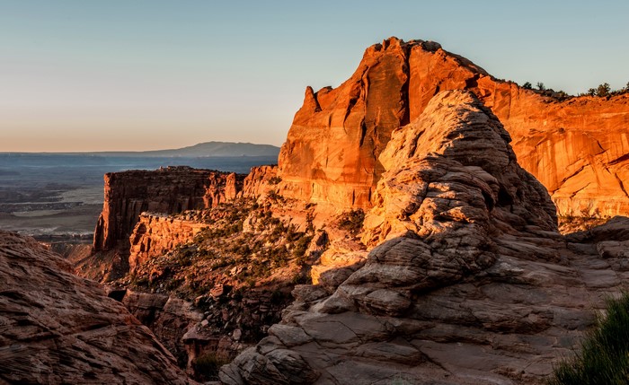 Sunrise over desert mountains and canyons