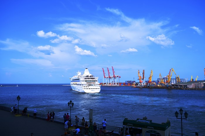 Cruise liner in Odessa port with cranes and people