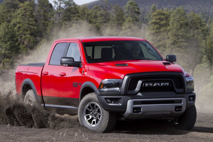 Red 2015 Ram 1500 Rebel driving off-road