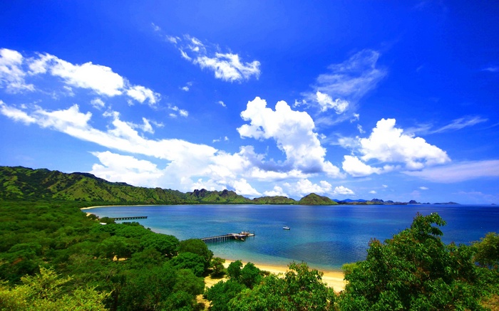 Tropical bay with green hills and blue sky