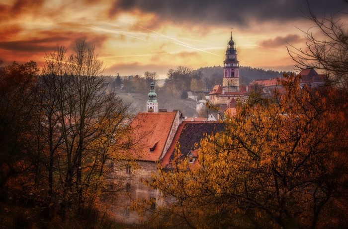 Autumn view of Český Krumlov with towers and red roofs
