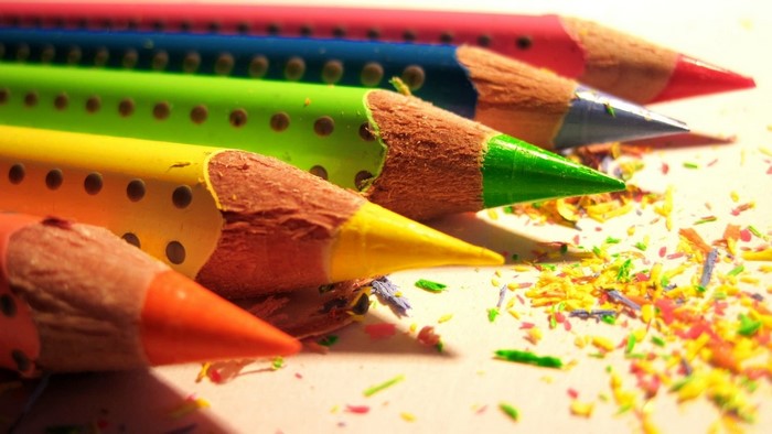 Close-up of sharpened colored pencils with shavings