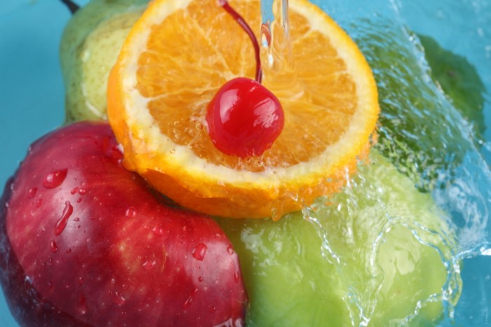 Close-up of fresh fruits with water splashes