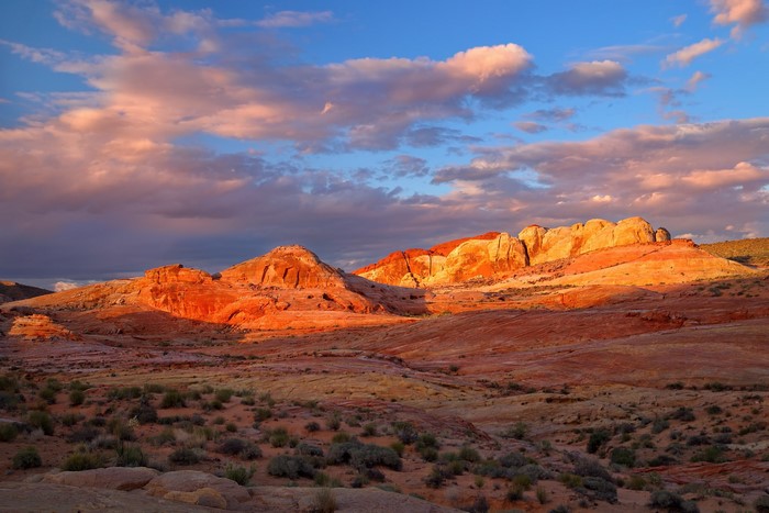 Desert mountains at sunset with colorful clouds
