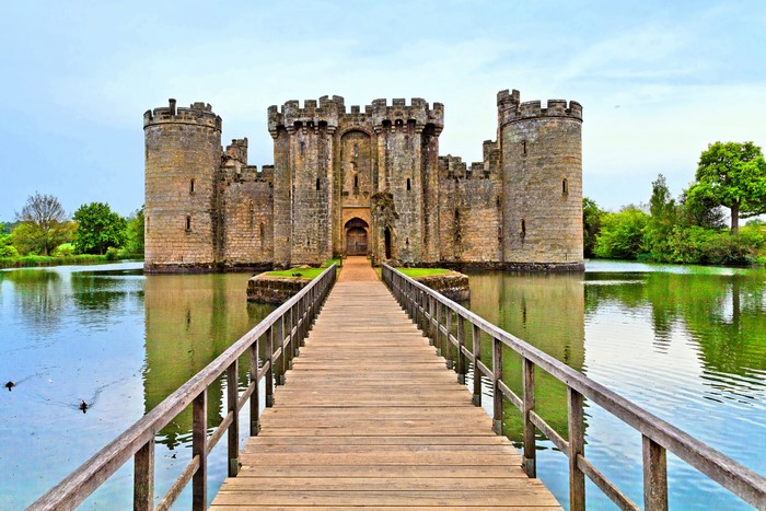 Castle surrounded by a moat with a wooden bridge