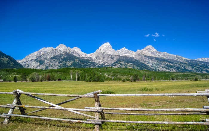 Grand Teton Mountains, Wyoming, USA, with a wooden fence