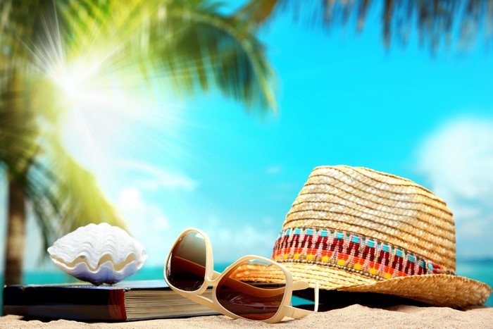 Summer Beach Scene with Hat, Sunglasses, Book, and Shell
