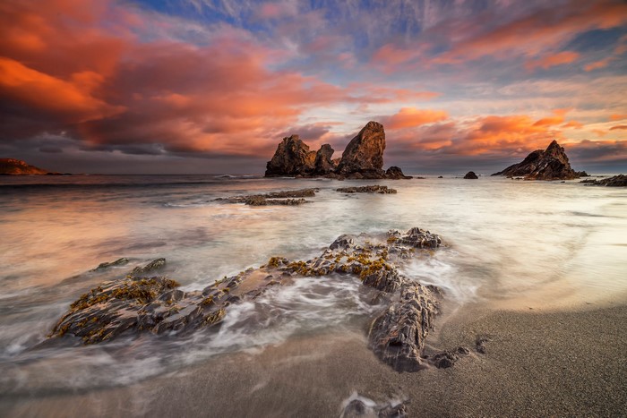 Rocky Coastline at Sunset with Dramatic Clouds